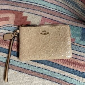 Coach Patent Leather Embossed Logo Wristlet – Beige